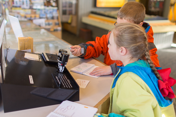 Visitor Center Passport Stamps in Rocky Mountain National Park with kids